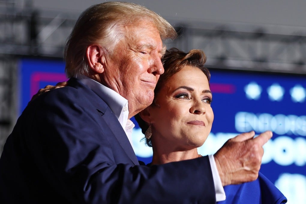 Kari Lake, pictured with Donald Trump, is a former news anchor who is considered a Republican rising star. Photo: AFP