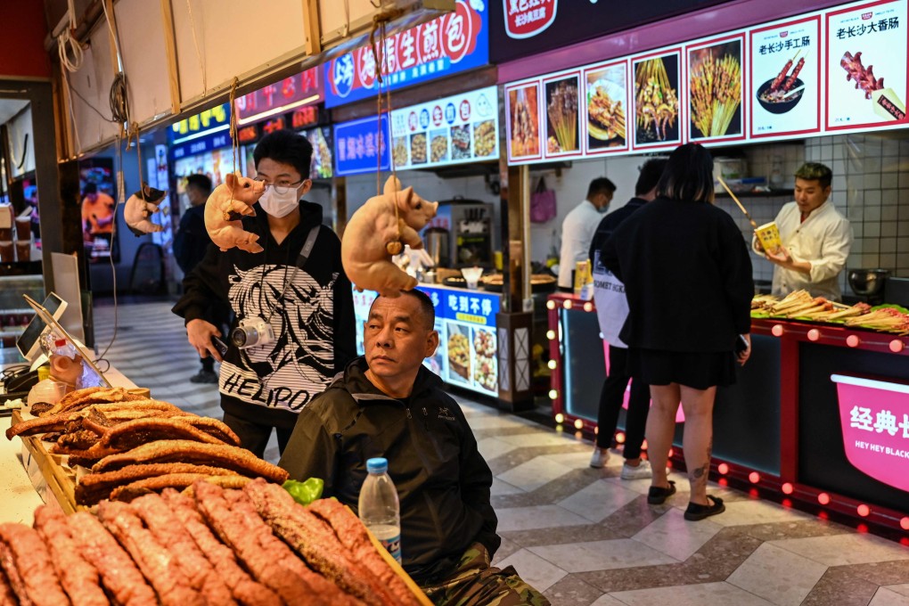 Shanghai officials found 568 Covid-19 cases in October, prompting lockdowns for tens of thousands of residents in more than 20 residential areas and hindering consumption. Photo: AFP