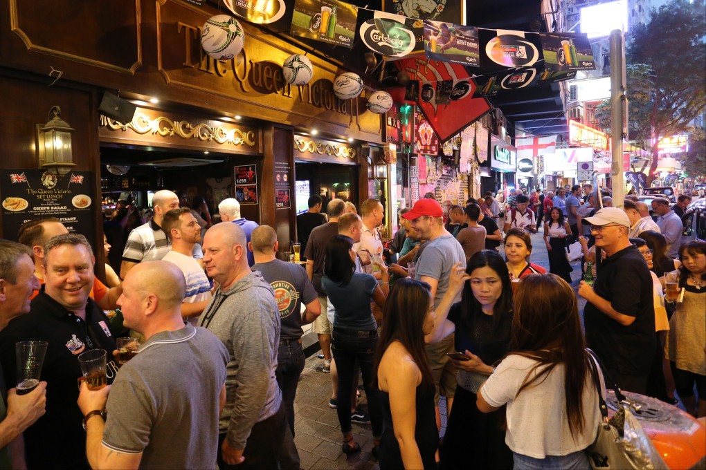 People spill out onto Lockhart Road in Wan Chai during the 2018 Hong Kong Sevens. Photo: Dickson Lee