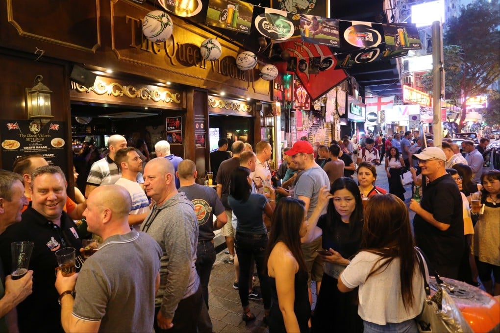 People spill out onto Lockhart Road in Wan Chai during the 2018 Hong Kong Sevens. Photo: Dickson Lee