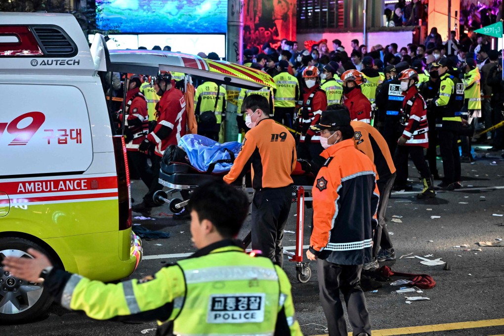 Paramedics attend to a victim believed to have suffered cardiac arrest in the popular nightlife district of Itaewon in Seoul on October 30. Photo: AFP