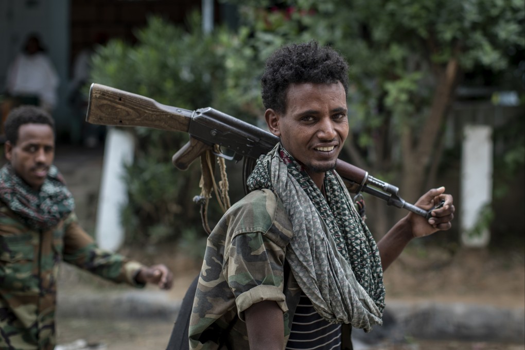 Fighters loyal to the Tigray People’s Liberation Front walk along a street in the town of Hawzen in the Tigray region of northern Ethiopia in May 2021. Photo: AP