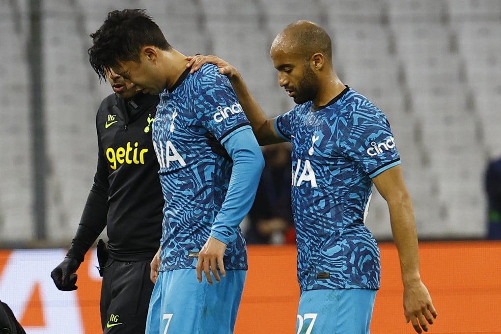 Hotspur’s Son Heung-min is helped off the pitch by Lucas Moura after sustaining an injury. Photo: Reuters