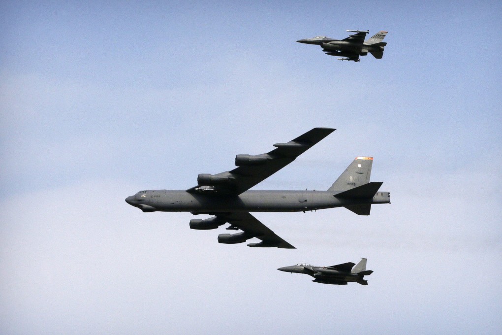 A US Air Force B-52 bomber flies over Osan Air Base in Pyeongtaek, South Korea. The United States is preparing to deploy up to six nuclear-capable B-52 bombers in northern Australia, according to an Australian news report. Photo: AP