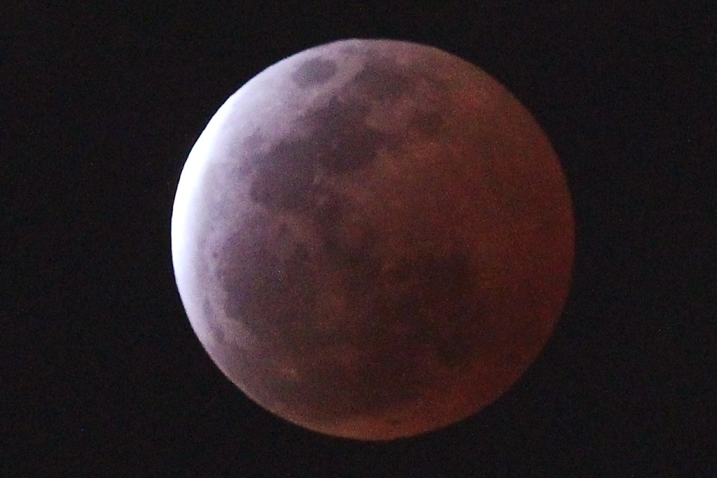 A “blood moon”, created by the full moon passing into the shadow of the earth during a total lunar eclipse, as seen from Tsim Sha Tsui. Hong Kong, on April 4, 2015. Photo: SCMP