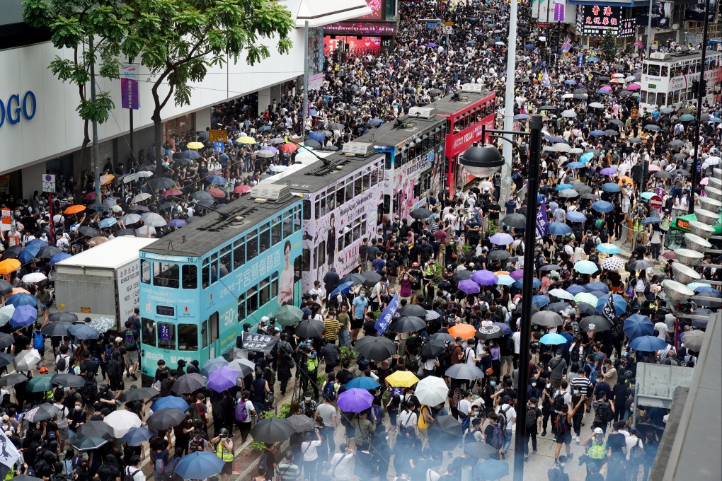 Protesters gather near  the Sogo department store in Causeway Bay for a march to Wan Chai in a 2020 protest over the Beijing-imposed national security law. Photo: Robert Ng