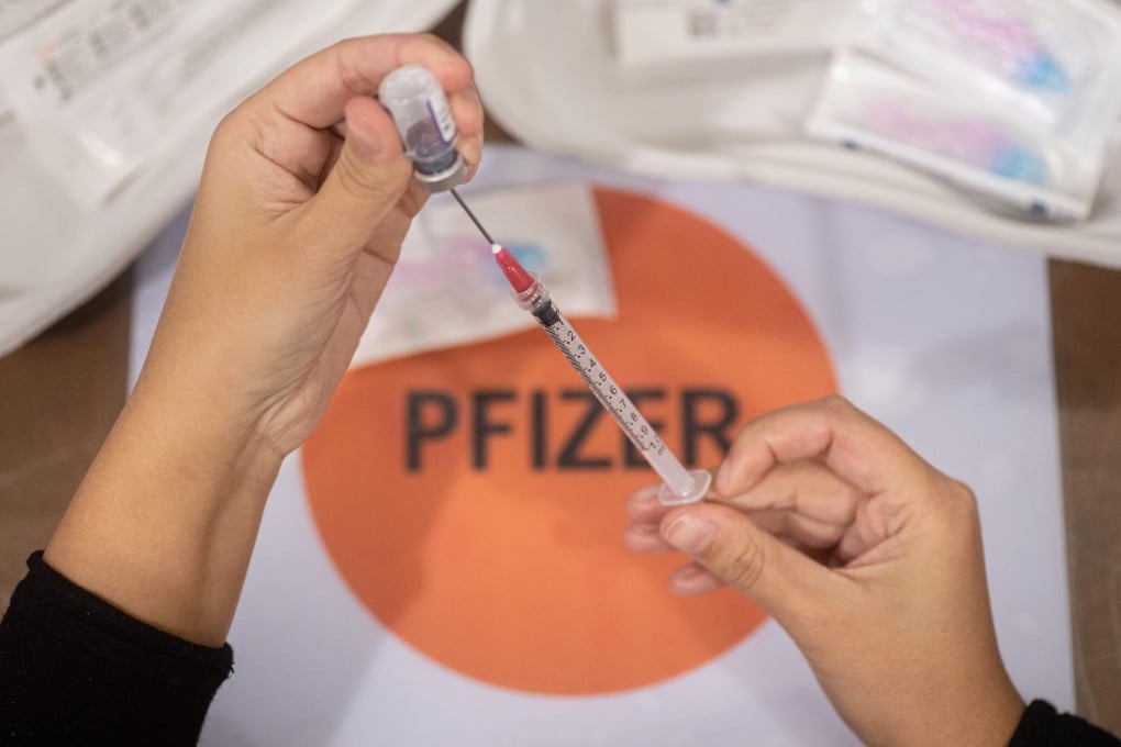 Close up at the vial with the inscription Comirnaty, mRNA etc, the needle and syringe while a female GGD healthcare worker prepares the Pfizer - BioNTech Covid-19 vaccines drawing them from the vial glass bottle to the syringes in the special area at the mega vaccination center in Eindhoven. The jabs are administered as a booster shot. The third-dose booster is available for all in the Netherlands in addition to the lockdown as the nation battles outbreaks of the new omicron variant coronavirus mutation of the pandemic. Eindhoven, The Netherlands on January 7, 2022 (Photo by Nicolas Economou/NurPhoto via Getty Images)
CREDIT: Getty Images