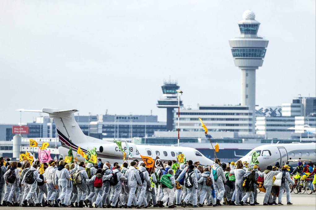 Environmental activists at Schiphol Airport in the Netherlands on Saturday. Photo: EPA-EFE