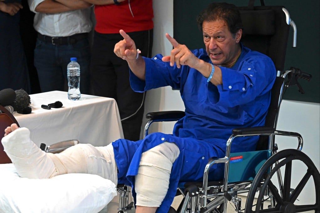 Pakistan’s former prime minister Imran Khan addresses the media at a hospital in Lahore on Friday. Photo: AFP