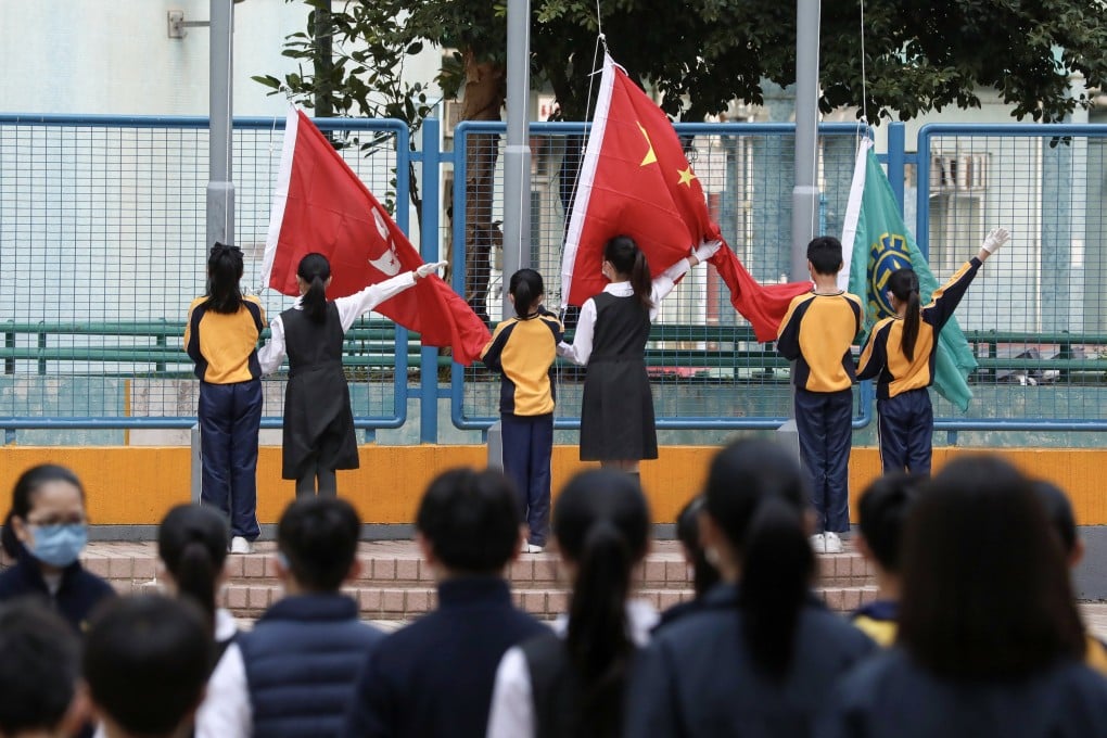 National education activities, such as flag-raising ceremonies, are to instil a sense of identity in students, a minister has said. Photo: Jonathan Wong
