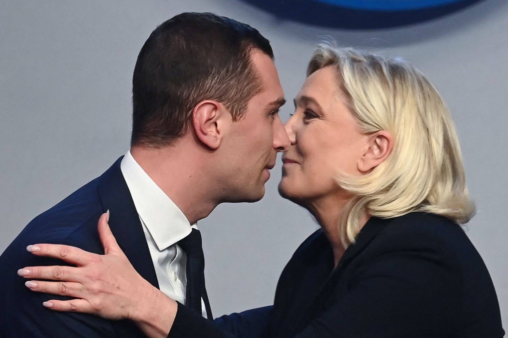 Newly elected French far-right party Rassemblement National (RN)‘s president Jordan Bardella, kisses former leader and current parliamentary group leader Marine Le Pen. Photo: AFP)