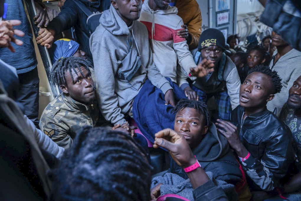 Migrants on the deck of the Rise Above rescue ship run by the German organisation Mission Lifeline, in the Mediterranean Sea off the coast of southern Italy on Sunday. Photo: AP