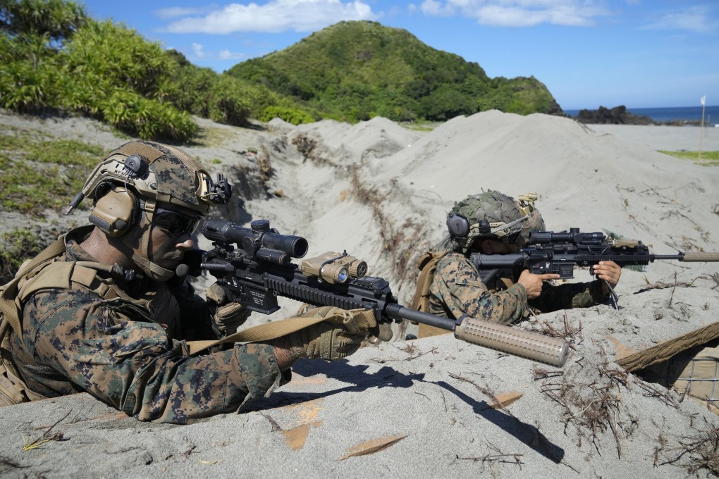 US Marines take up position in a trench during a joint US-Philippines military exercise in March. Photo: AP