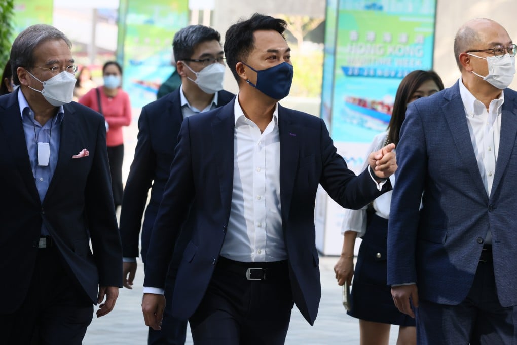 Gary Wong (centre) submits nomination forms for the Legislative Council by-election. Photo: Dickson Lee