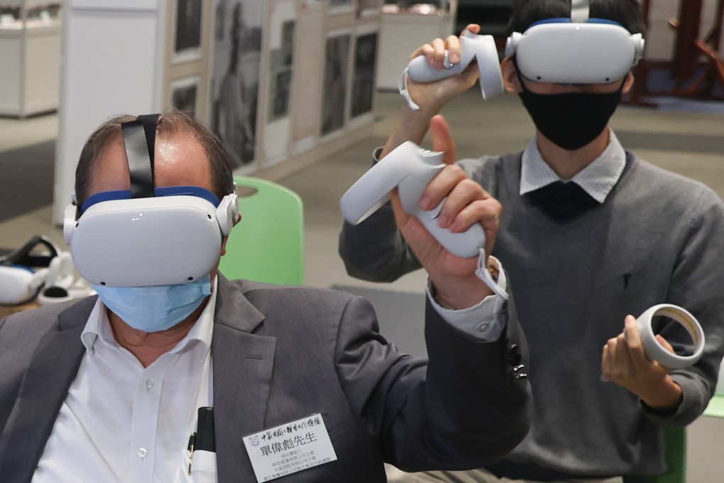 People try out VR headsets for a wing chun experience. Photo: Yik Yeung-man
