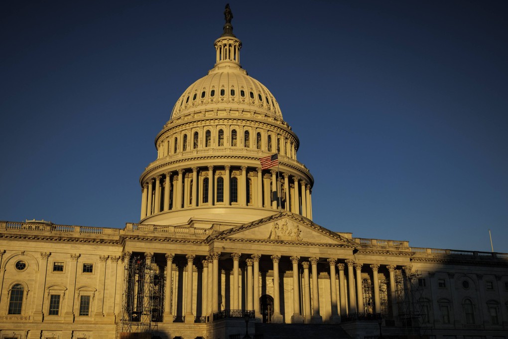 The rising sun creeps across the US Capitol building on Wednesday, the morning after Americans voted in the country’s midterm elections. Photo:  Getty Images/AFP