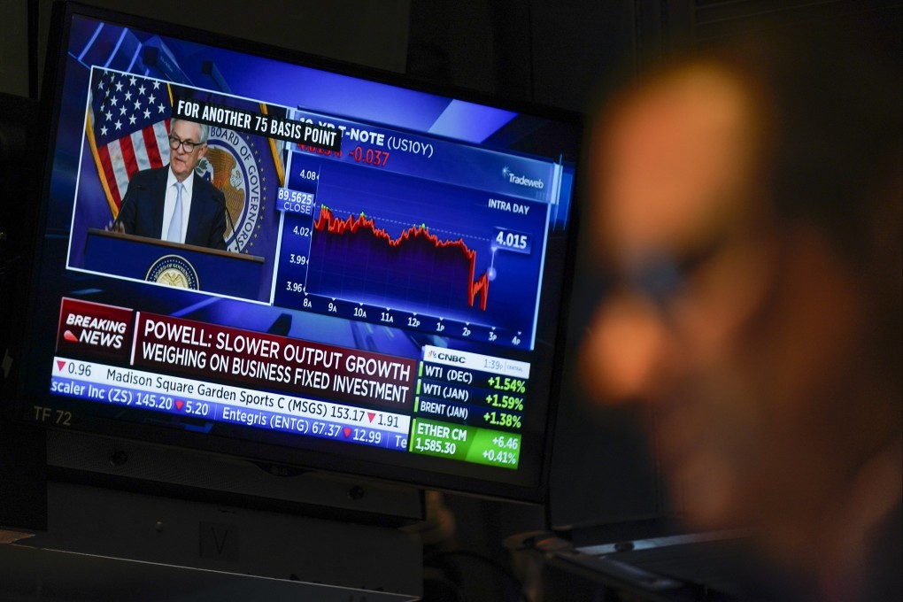 Traders work on the floor at the New York Stock Exchange as Federal Reserve chairman Jerome Powell speaks after announcing a rate increase on November 2. Looming uncertainty about US monetary policy and the broader economy is making it difficult to tell whether the US stock market has bottomed out. Photo: AP