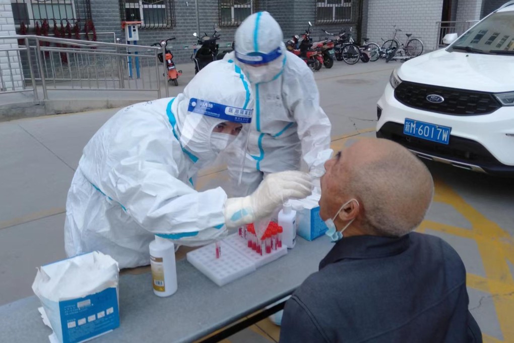 Health workers in Korla, the second largest city in China’s Xinjiang region, test a resident for Covid-19. Photo: Weibo