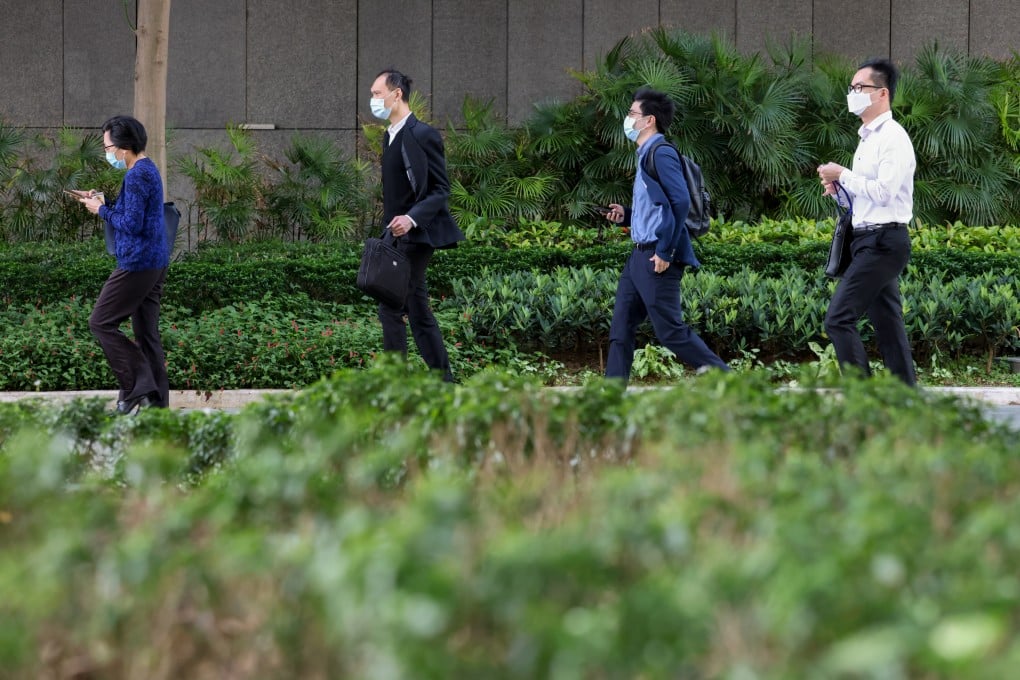 Civil servants head to work at the government’s headquarters in Admiralty on May 22. Photo: Nora Tam