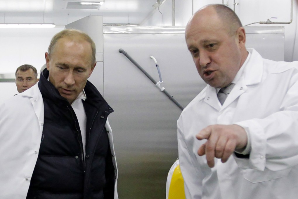 Businessman Yevgeny Prigozhin shows Russian Prime Minister Vladimir Putin his school lunch factory outside St Petersburg in September 2010. Photo: Sputnik/AFP via TNS
