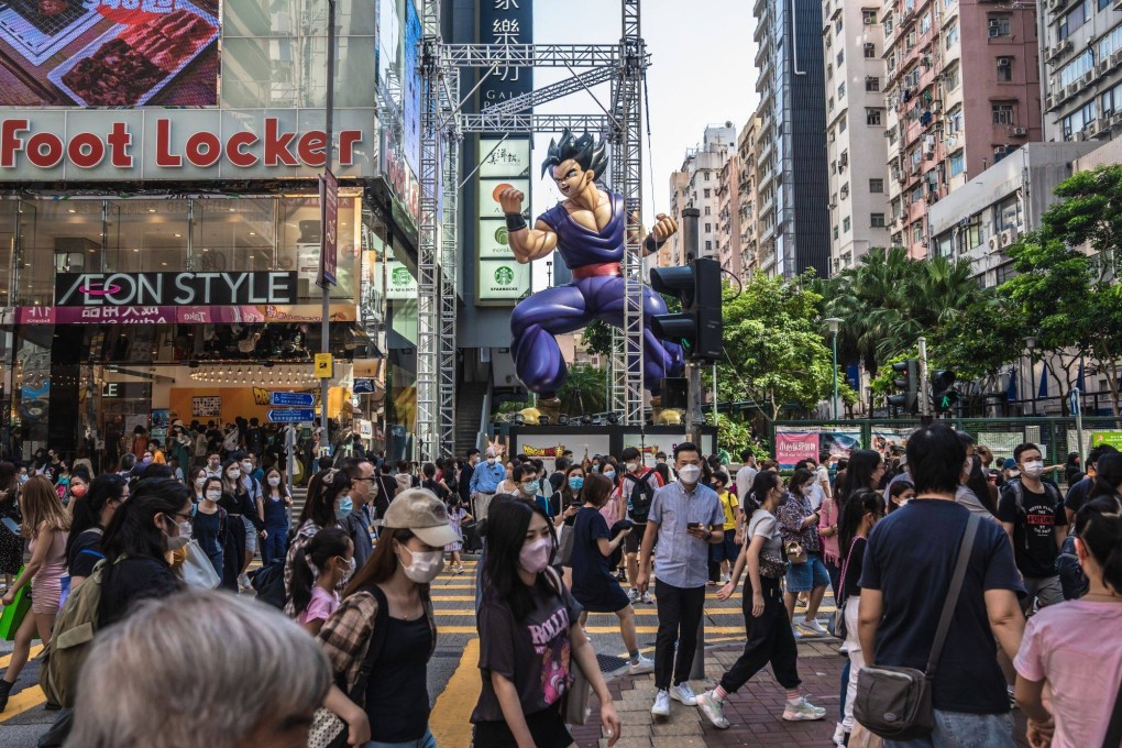 Pedestrians cross a road in Hong Kong on October 15. Hong Kong wants to become an international centre for virtual assets as the city seeks to bolster its status as a global financial hub after pandemic disruptions. Photo: Bloomberg