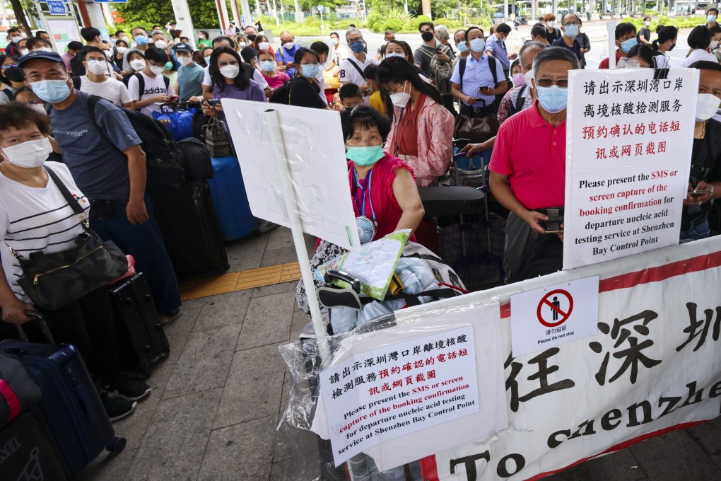 Travellers line up for Covid-19 tests at Shenzhen Bay Port in Hong Kong. Arrivals in mainland China will only spend five days in hotel quarantine. Photo: Dickson Lee