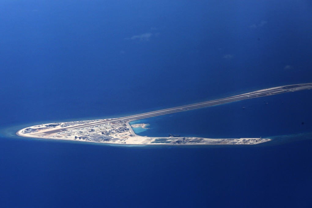Chinese structures and an airstrip are seen on the artificial Subi Reef in the contested Spratly Islands in the South China Sea. A code of conduct is being negotiated to manage tensions in the waterway. Photo: AP