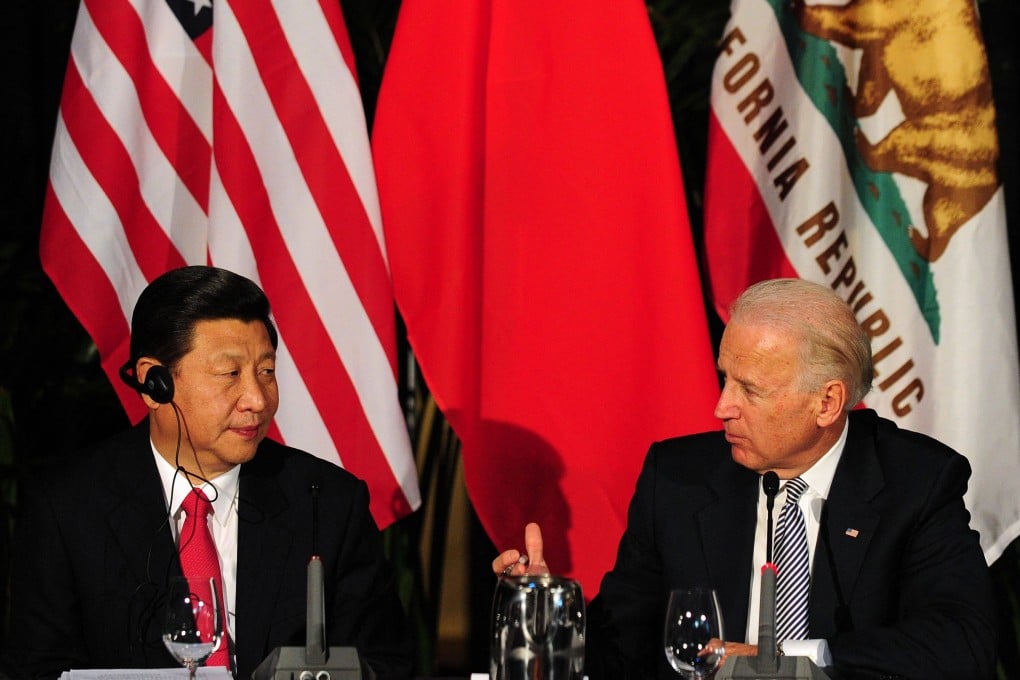Then US vice-president Joe Biden speaks to visiting Chinese counterpart Xi Jinping in Los Angeles in 2012. Photo: AFP