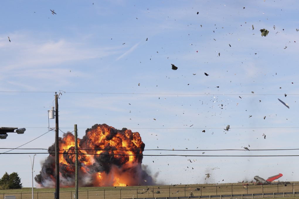 A historic military plane crashes after colliding with another plane during an airshow at Dallas Executive Airport in Dallas, Texas, US on Saturday. Photo: Nathaniel Ross Photography via AP