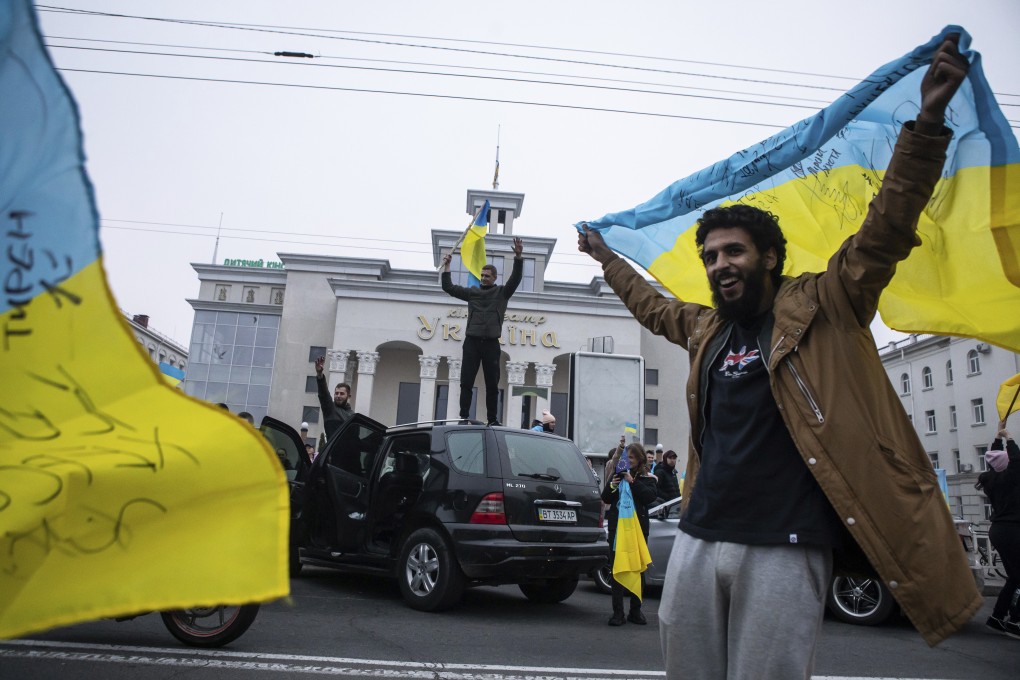Ukrainians gather in downtown to celebrate the recapturing their city, Kherson, Ukraine on Saturday. Photo: AP