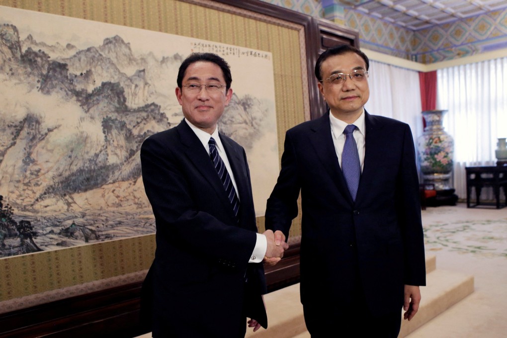 Japan’s then foreign minister Fumio Kishida with Chinese Premier Li Keqiang in Beijing in 2016. Kishida met Li for the first time as prime minister in Cambodia on Saturday. Photo: Reuters