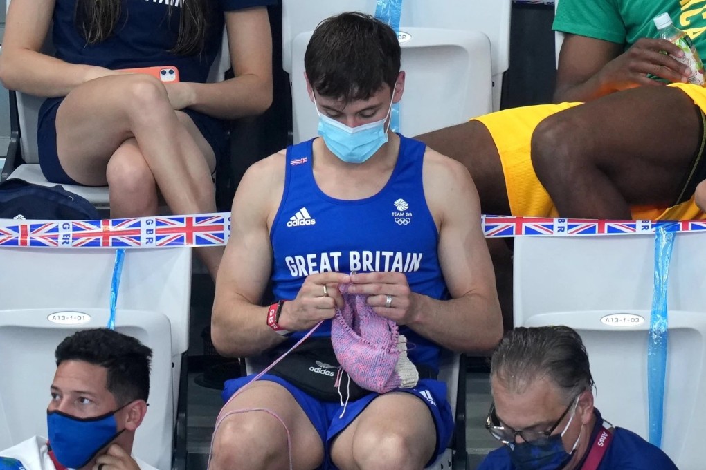 British diver Tom Daley knits at the Tokyo Olympics. His and other celebrities’ affinities with knitwear has caused it to surge in popularity recently. Photo: Getty Images