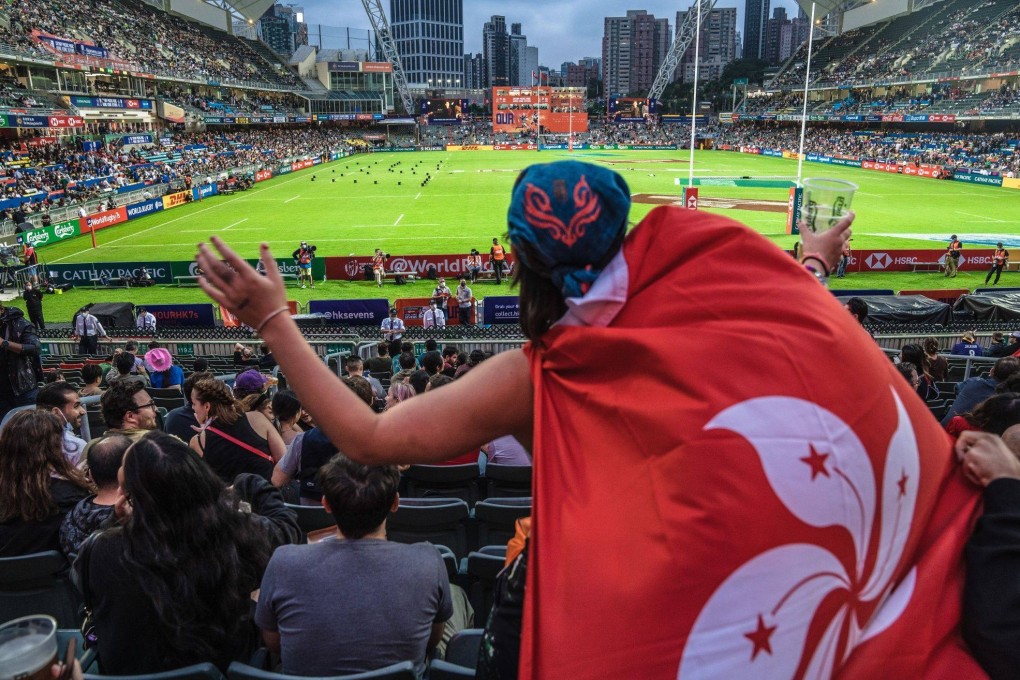A spectator wears a Hong Kong flag in the Hong Kong Stadium on November 4, at the first rugby Sevens tournament in Hong Kong since the pandemic began. Photo: Bloomberg