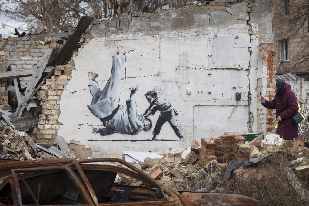 An artwork that might have been made by British street artist Banksy on a building destroyed by fighting in Borodyanka, Kyiv region, Ukraine. Photo: AP
