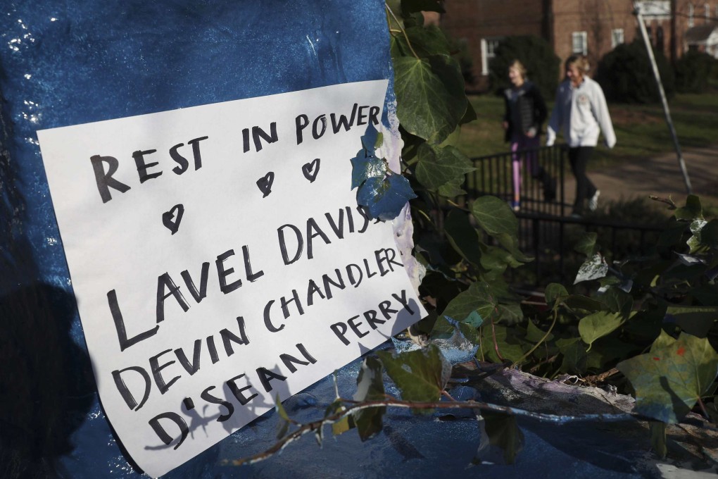 A sign memorialising three University of Virginia football players killed during an overnight shooting in Charlottesville, Virginia. Photo: AFP