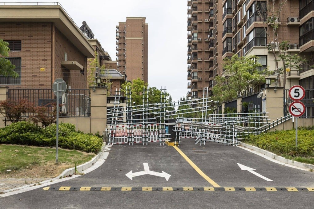 Barricades from recent Covid-related lockdowns block an entrance leading to Country Garden’s Fengming Haishang residential development in Shanghai in July 2022. Photo: Bloomberg