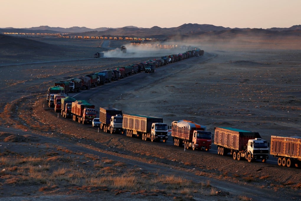 Thousands of heavy-duty trucks loaded with coal extending as long as 130 kilometres from the Mongolia-China border on a road in the Gobi desert. Photo: Reuters
