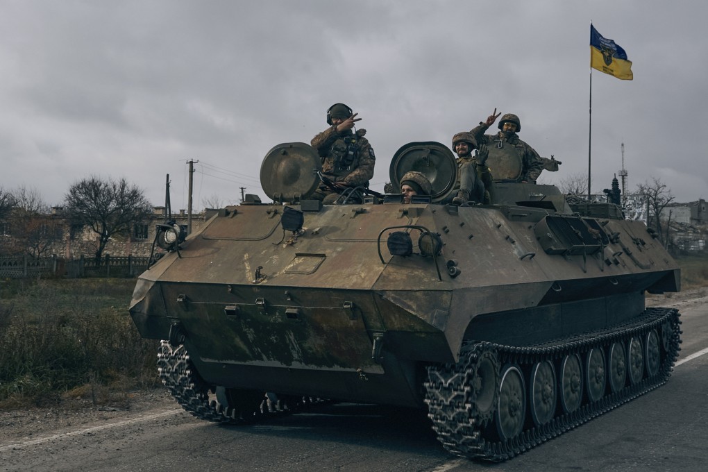 Ukrainian soldiers ride a captured Russian armoured personnel carrier in Kherson on November 13. Photo: AP
