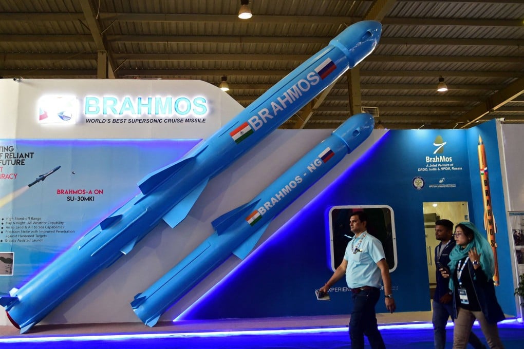 Visitors walk past a model of India’s BrahMos supersonic cruise missile displayed at the Defence Expo 2022 in Gandhinagar on October 18. The appeal of Russian weaponry is fading in India at the same time as Russian oil is flowing to India at a record pace. Photo: AFP