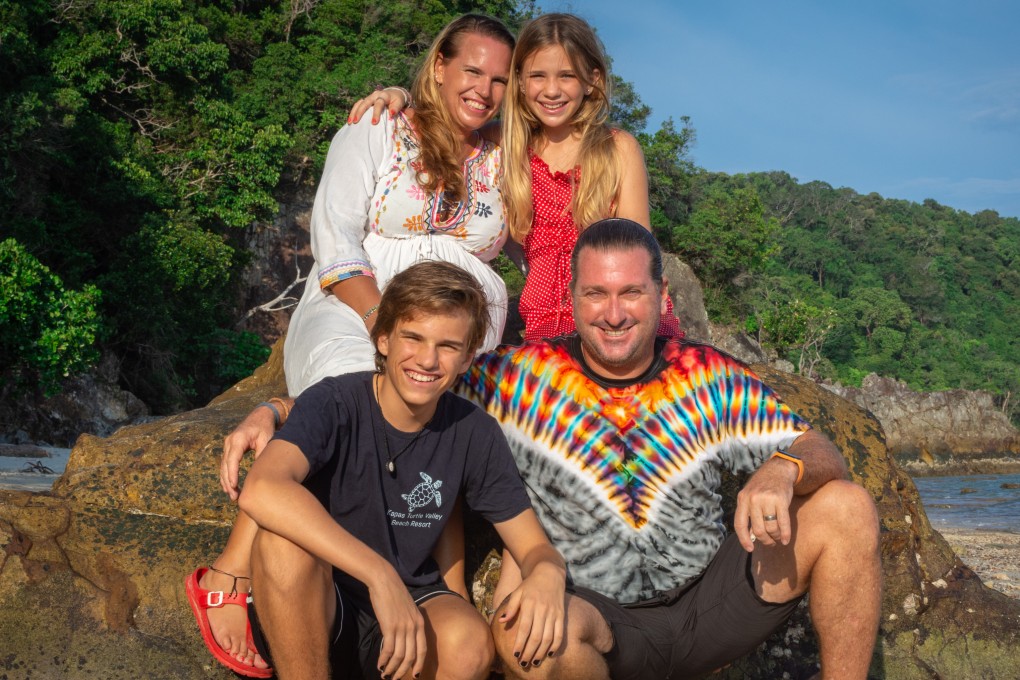 Nadia Louw (back left) and Nicholas Smith (front right) and their children Liam and Mila on Kapas Island, Malaysia. In 2019, Louw bought a tiny resort on the island. Photo: Christophe Wauters