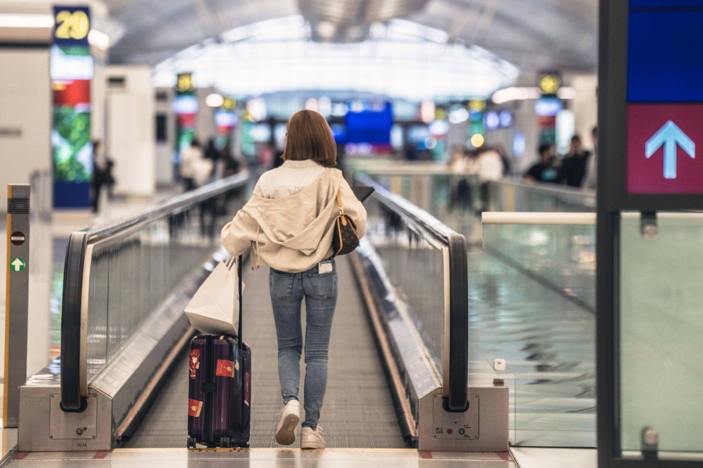 Travelers at Hong Kong airport on November 1. Photo: Bloomberg