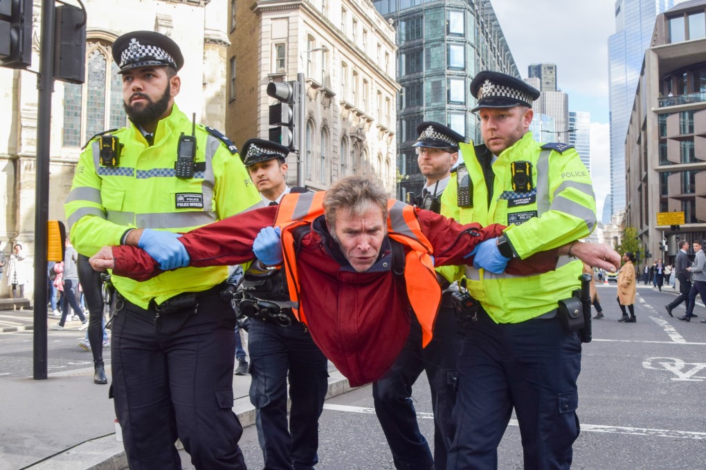 Police arrest a protester during a protest in October by Just Stop Oil activists in London. Photo: dpa