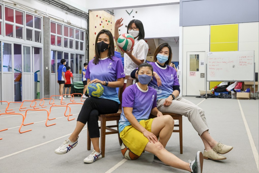 (L-R) Peony Tam, Project manager (L1); Student Emma Yung Yuen-chi (Upper row, L2) from Ng Yuk Secondary School; Jay Kan (R1), Project Consultant and Alicia Lui (Lower row, L2) , founder of Women In Sports Empowered Hong Kong pose at the Ng Yuk Secondary School. 18OCT22 SCMP /K. Y. Cheng