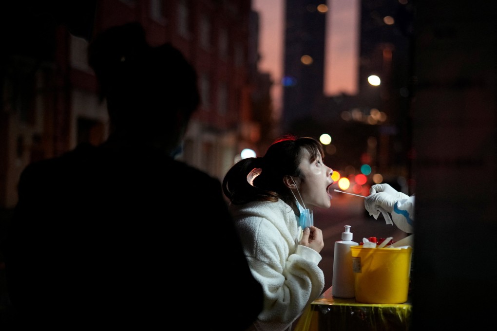 A woman gets tested for Covid-19 at a nucleic acid testing site in Shanghai on November 15. China is confronting its most severe outbreak in months, and easing controls will exacerbate the virus spread. How much tolerance Beijing has for a deterioration of conditions before it puts its foot back on the brake is difficult to tell. Photo: Reuters