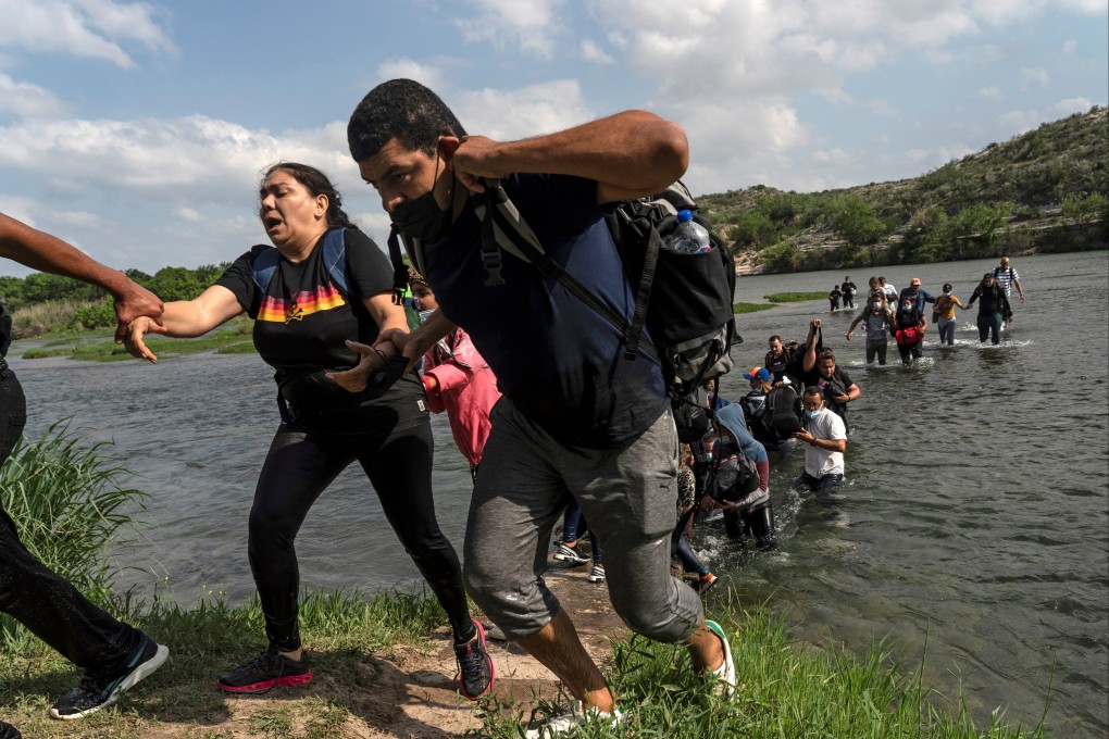 Asylum-seeking migrants from Venezuela reach the shore after crossing the Rio Grande into the United States from Mexico in May last year. Photo: Reuters