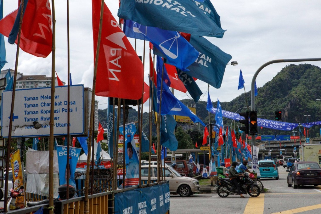 Election campaign party flags in Gombak district in Selangor on November 15, 2022. The two-week campaign for the 2022 general election – which comes to a close at midnight on Saturday – has been one of unfamiliar standing for most of the coalitions and parties competing for control of the 222-seat lower house of parliament. Photo: Bloomberg