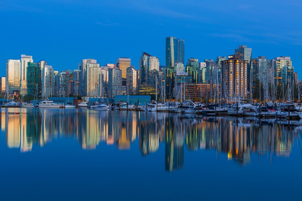 Vancouver, British Columbia’s skyline and reflection by the marina. The city has seen a bump in Hongers immigrating there, reversing recent trends. Photo: Shutterstock