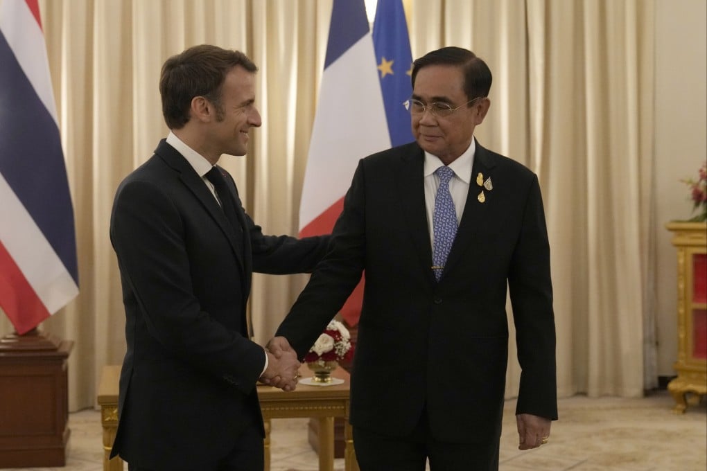 French President Emmanuel Macron shakes hands with Thailand’s Prime Minister Prayuth Chan-ocha in Bangkok on Thursday, before the start of the Apec summit. Photo: EPA-EFE