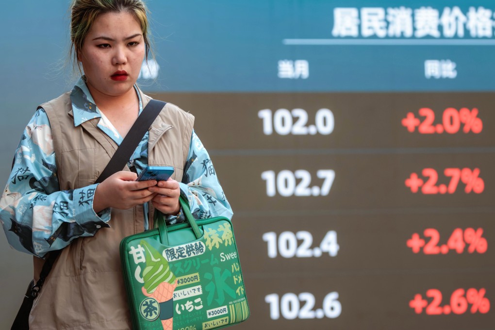 A woman walks past a display showing stock exchange data in Shanghai. Chinese tech stocks like Alibaba and Tencent have surged in recent weeks on improving business outlook. Photo: EPA-EFE
