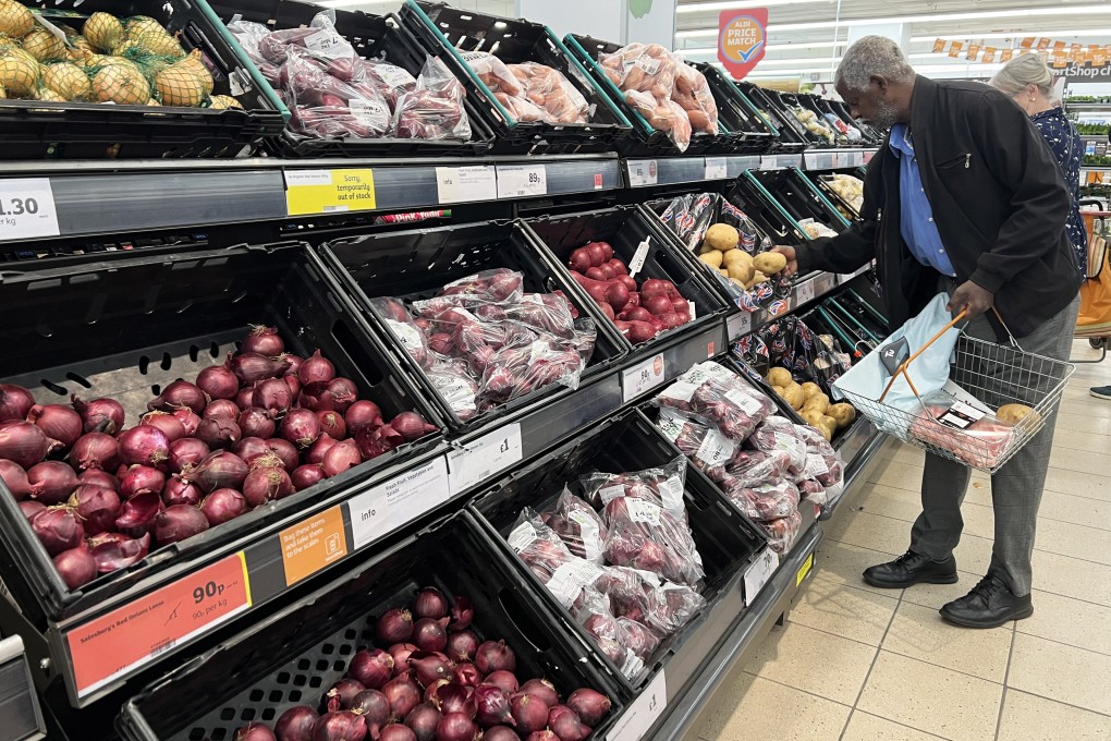 A man shops in a supermarket in London. UK food prices rose a staggering 14.7 per cent in October, the fastest pace in 14 years. Photo: Xinhua